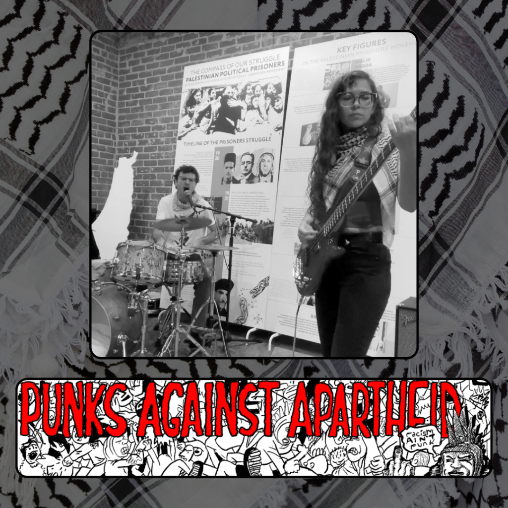 A photo of a drummer shouting into a mic in the background in front of a large cut-out map of Palestine and a big banner with text that is not readable. In foreground, a bassist wearing a kufiyyeh.
Below, a long horizontal banner depicting a punk mosh pit, with large red squiggly letters depicting PUNKS AGAINST APARTHEID on top, and a punk giving the finger on the right saying ‘racism ain’t punk.’